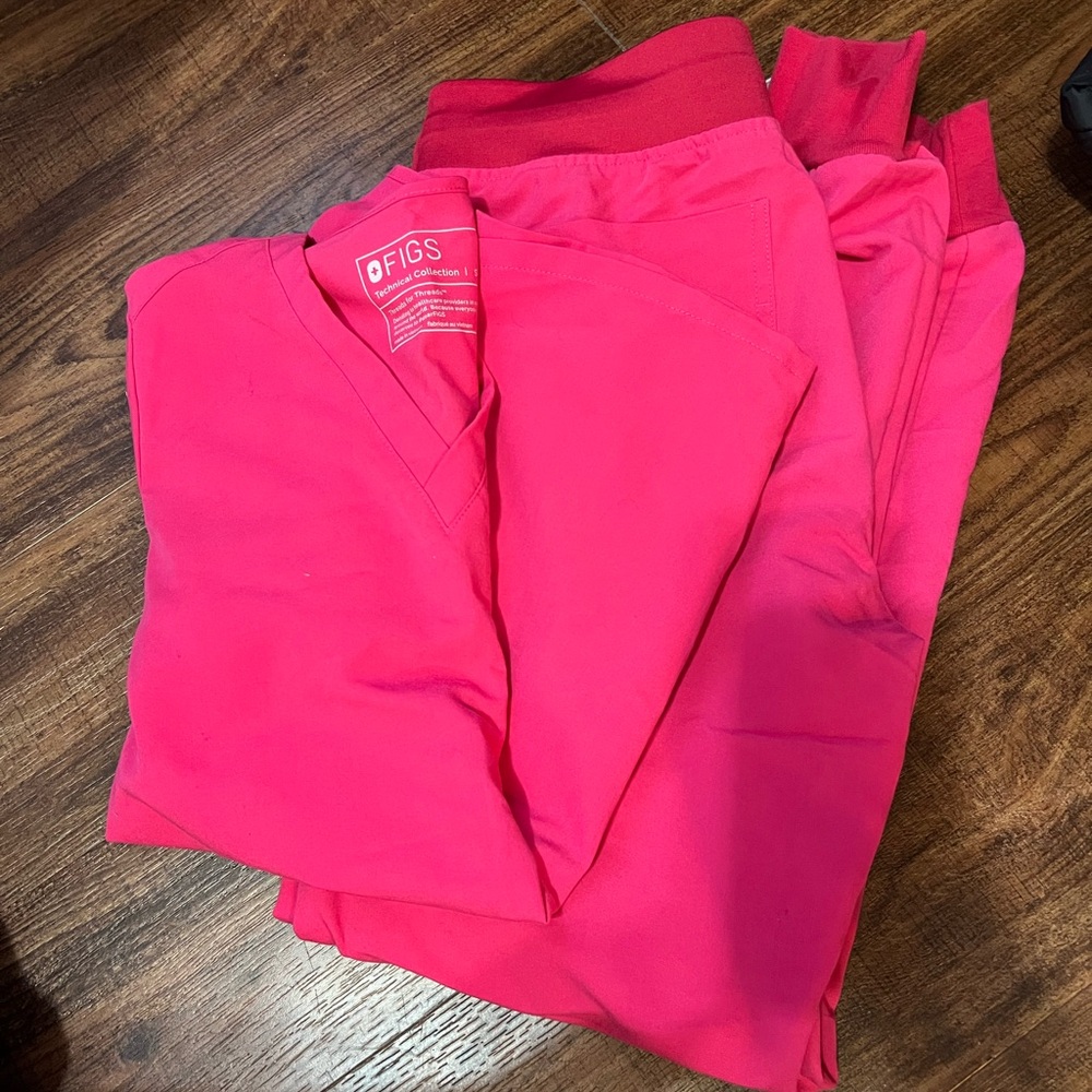 Bundle of two sets of scrubs.
